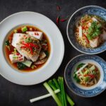 Chinese steamed fish with ginger and spring onion