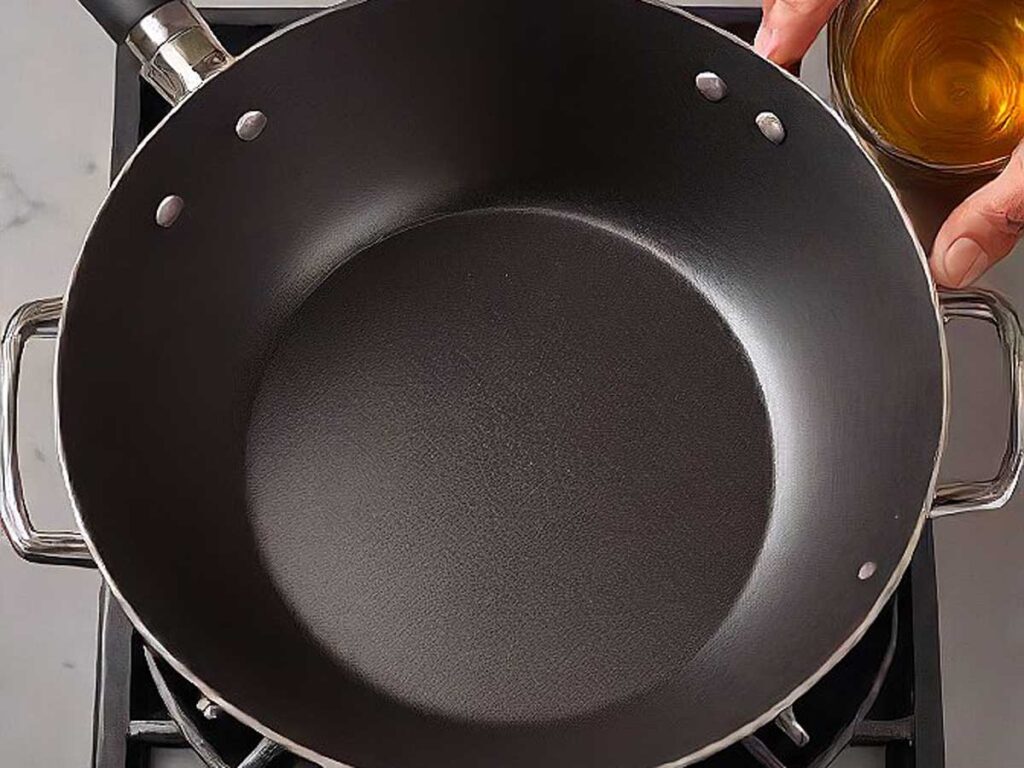 Heating a wok with oil for stir frying